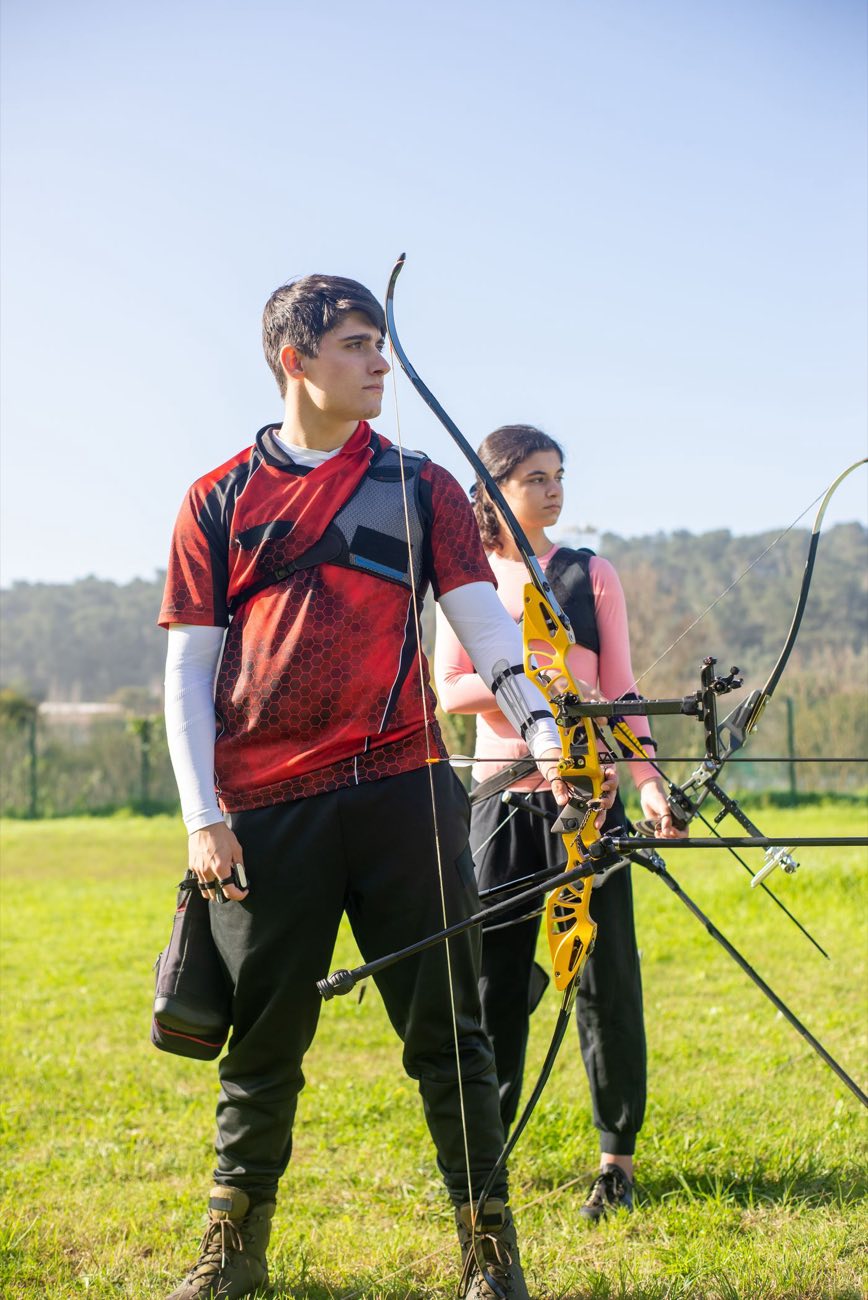 Two archers training on the shooting line