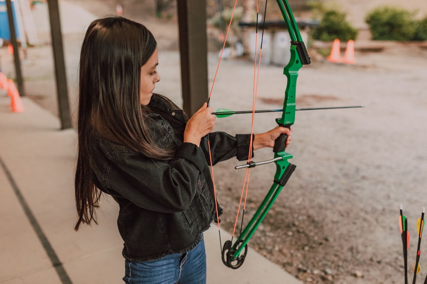 Young archer drawing the string
