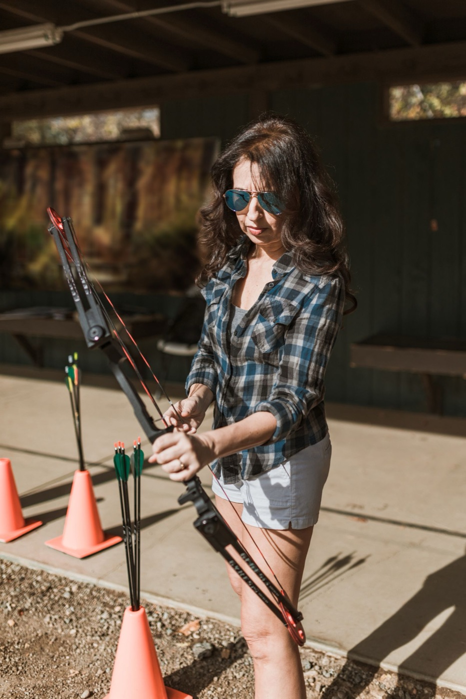 Archer standing on the shooting line, with bow and arrows