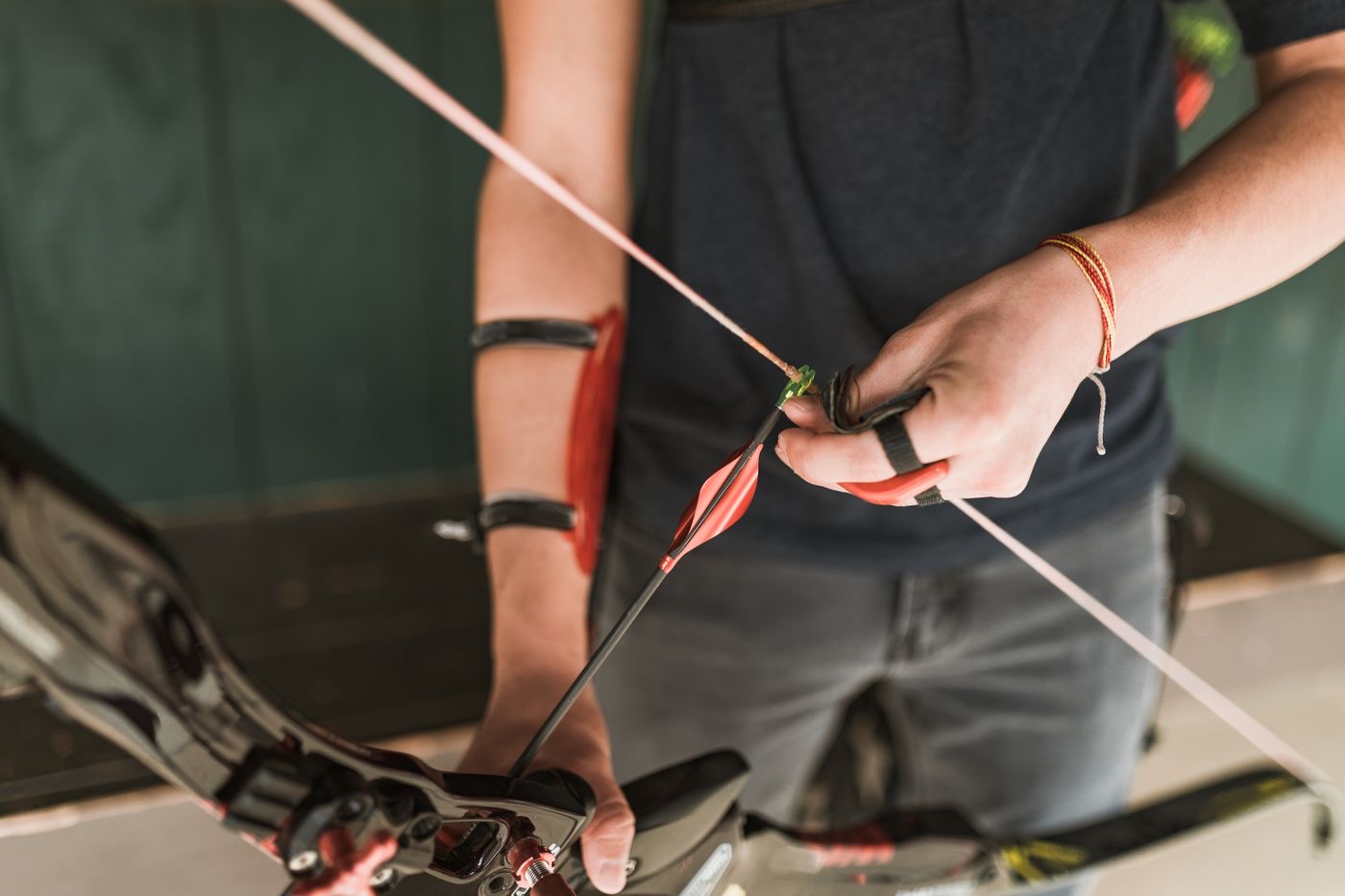 Archer setting up the shot with a recurve bow