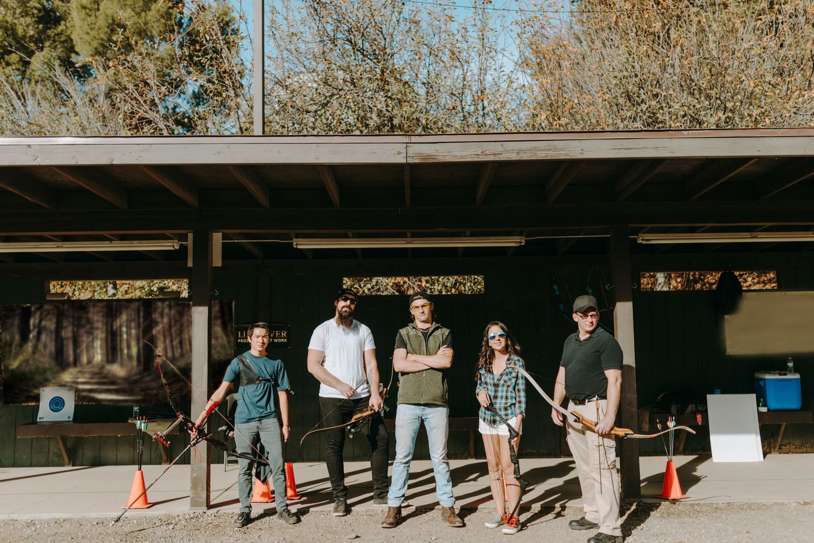 Row of archers on an outdoor shooting line