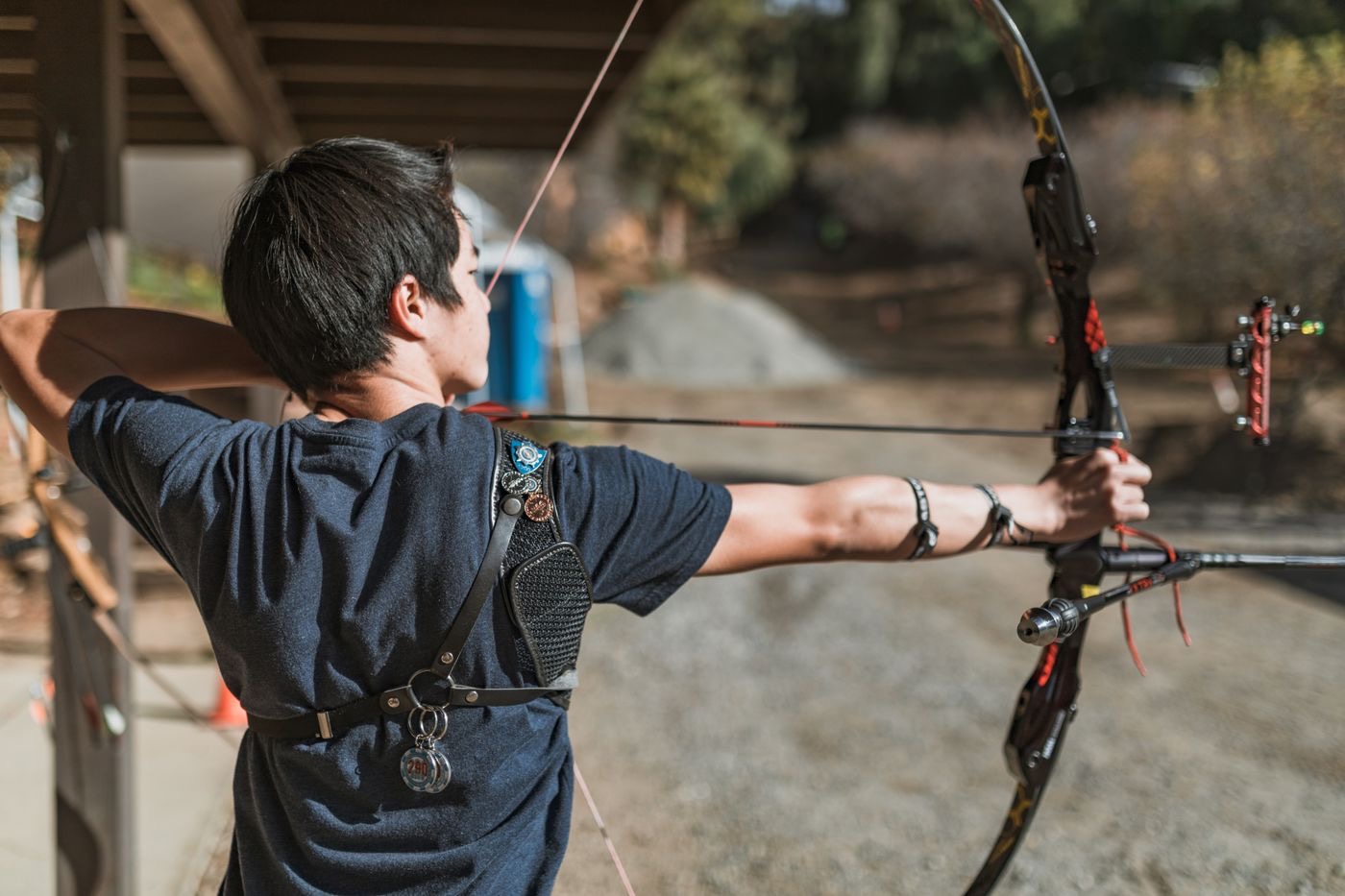 Side view of an archer aiming